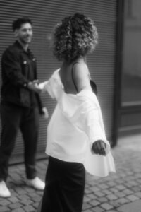 Laughing couple walking through Prague - authentic and raw storytelling with a cinematic vibe
