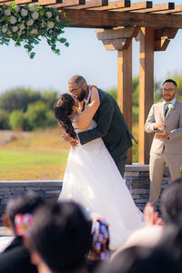 bride and groom dip kiss at fairview metropolitan in oakland california
