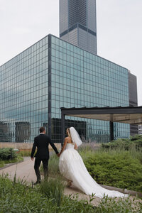 Editorial wedding photography at Old Post Office Chicago features Lauren Alatriste's fashion forward approach to ceremony coverage, creating sophisticated imagery that combines architectural grandeur with luxury wedding aesthetics and authentic emotional storytelling.