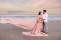 Expectant parents pose for Beach Maternity Photos during their Babymoon in Charleston, SC.