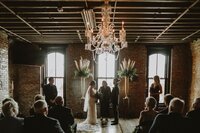 Beautiful moody ceremony space at one of Kentucky's best wedding venues, O'sheas, in downtown louisville