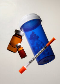 Studio still life of Mochi packaging and vials on a light background