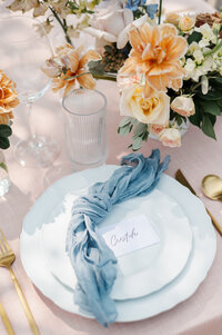 Elegant wedding table styling with soft florals and place setting captured in wedding photography in Detroit