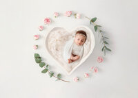Infant posed for Newborn Baby Photos at Holy City Babies Portrait Studio in Charleston, SC.