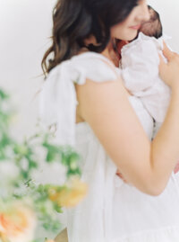 Mother holding baby during Denver newborn session.