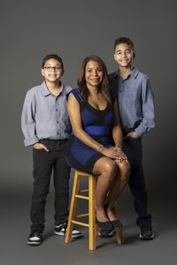 Parents and two children photographed at Timeless Photography Studios near Edmonton