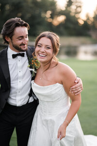 Candid portrait of smiling bride and groom in natural light captured in wedding photography in Detroit