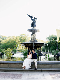 A documentary wedding photographer's capture of a couple at Bethesda Fountain, highlighting a genuine connection in an iconic New York setting.