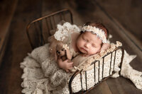 Newborn baby posed during her studio newborn session with Jennifer Brandes Photography, serving Glencoe and surrounding South Central Minnesota communities.