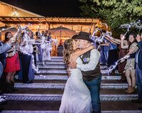 Bride and Groom at their sparkler send off at Azle Deer Cove captured by Graceful Ray Photography in Fort Worth Texas