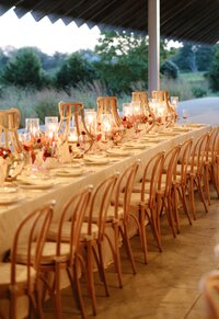 Wedding tablescape setup with candles and florals