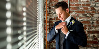 groom prep reading photographer