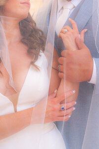 bride and groom details under veil at san francisco city hall wedding