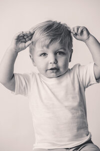 Baby boy looks at the camera during Personality Portrait Photoshoot in Charleston, SC.