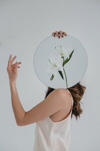 model posing with flowers in albuquerque studio photoshoot.
