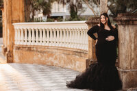 Maternity Photos in Charleston, SC -- Expectant mother poses for Maternity Portraits in downtown Charleston, SC.