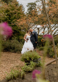 Candid photo of the Bride and Groom having a quiet moment before their wedding at Mcmenamins Edgefield.