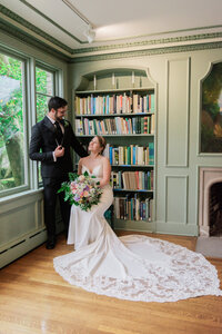 Bride and groom portrait at a library wedding venue in Los Angeles with soft window light, true to life color, and a fine art style.