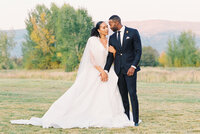 couple standing in a field photographed by a Lake Tahoe wedding photographer