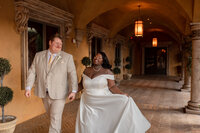Bride and groom dancing together at their elegant indoor wedding venue