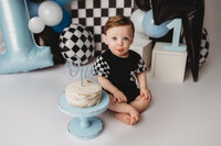 Baby celebrates his first birthday with Cake Smash Pictures at Holy City Babies Portrait Studio in Charleston, SC.