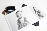 Black and white fine art album spread featuring playful child portraits, Kaitlyn Dawn Photography, Yucaipa family photographer.