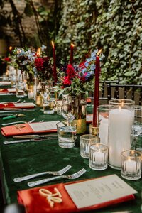 Gem toned wedding reception table at Shreveport garden venue