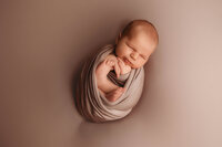 Infant posed for Newborn Photos in Charleston, SC.