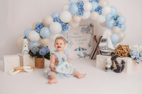 Baby celebrates her 1st birthday with a Cake Smash Photoshoot at Holy City Babies Portrait Studio in Charleston, SC.
