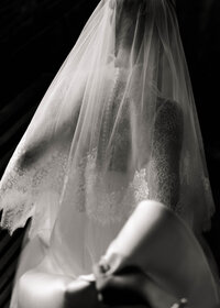 bride walking in dramatic lighting