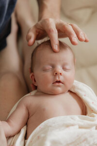 dad-fingers-newborn-forehead-gentle-in-home-lifestyle-boulder-photographer-187