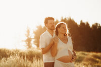 Pregnancy photoshoot during golden hour at the beach in Christchurch