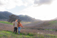 mt diablo summit mountainside couple in open field for engagement photos in bay area california.