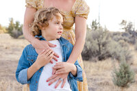 Mom embracing their kids during a golden hour family session in Bend Oregon