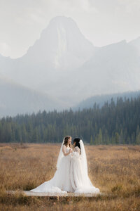 Couple dancing in Mt.Engagine meadow on their wedding day.