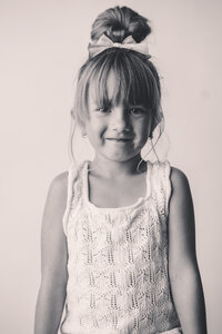 Little girl smiles at the camera during Personality Portrait Photoshoot in Charleston, SC.