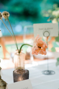 One single floral and in glass vase on a table