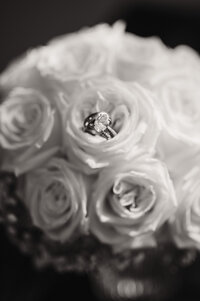 close up shot of the rings in the brides bouquet captured by shelly voss