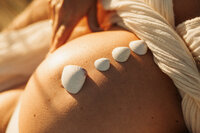Christchurch beach maternity photographer with shells