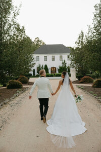 bride and groom walking towards the Bradford wedding venue