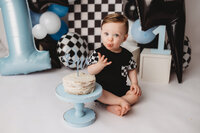 Baby celebrates his first birthday with Cake Smash Pictures at Holy City Babies Portrait Studio in Charleston, SC.