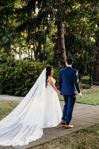 couple-walking-garden-path