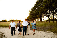 a generational session walks together during their family session at erwin park in mckinney,texas