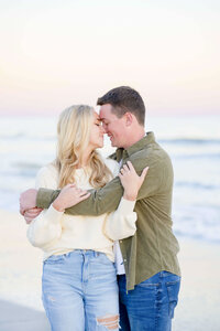 Engaged couple at Folly Beach in Charleston South Carolina