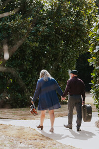musical-couple-walking-holding-hands-the-belle-crane-inn