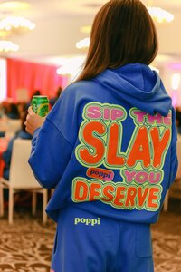 Candid branded detail photographed during a corporate event, highlighting custom apparel and brand messaging