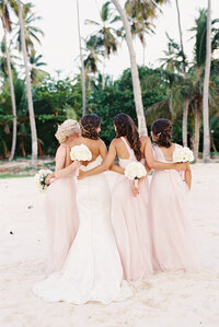 Brides and her bridesmaids in a wedding photo shoot at the beach in the Dominican Republic