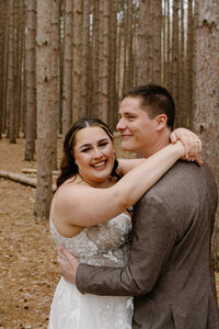 A couple's elopement photo in the woods