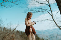 crimson conure photography's georgia and colorado based owner, Kyra Eybelman, walking toward the camera for a photo shoot