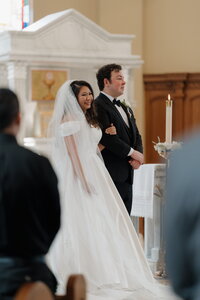 Couple being married at St. Benedict Catholic Church in Johns Creek, Georgia